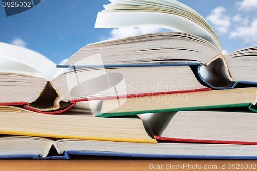 Image of close up of books on wooden table