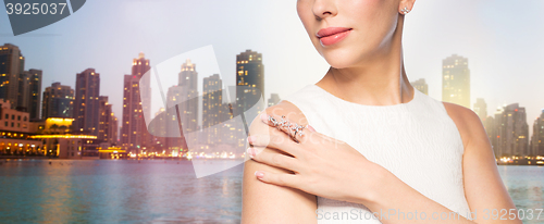 Image of close up of beautiful woman with ring and earring