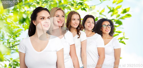 Image of group of happy different women in white t-shirts