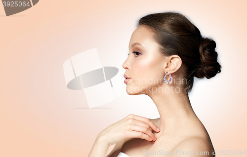 Image of close up of beautiful woman face with earring