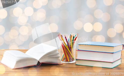 Image of close up of crayons or color pencils and books