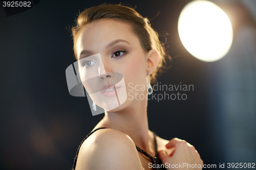 Image of beautiful young asian woman with earring