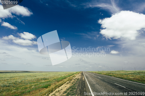 Image of asphalt road with a marking leaving afar