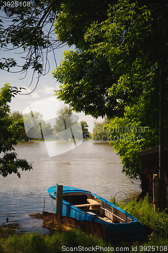 Image of the boat was moored to the banks of the river