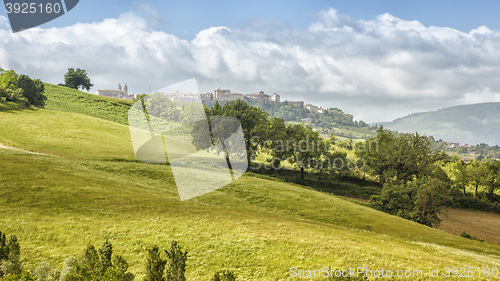 Image of Camerino in Italy Marche over colourful fields