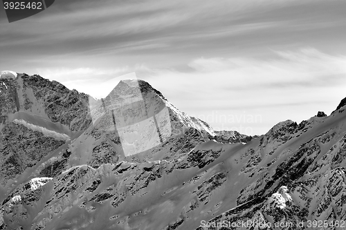 Image of Black and white high mountains in winter evening