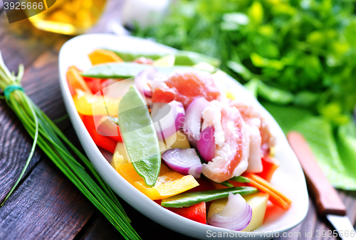 Image of raw meat with vegetables