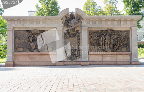 Image of Moscow, Russia - August 11, 2015: bronze bas-relief depicting the Battle of Borodino and other battles the war of 1812, in front of the monument to Emperor Alexander I in the Alexander Garden Moscow K