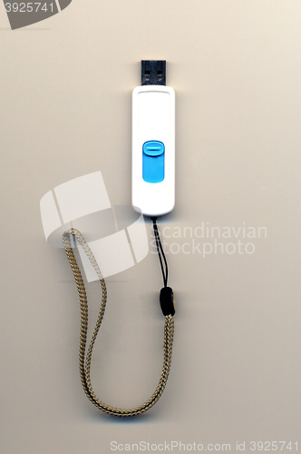 Image of flash drive white with blue button