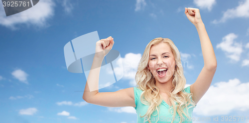 Image of happy young woman or teen girl celebrating victory