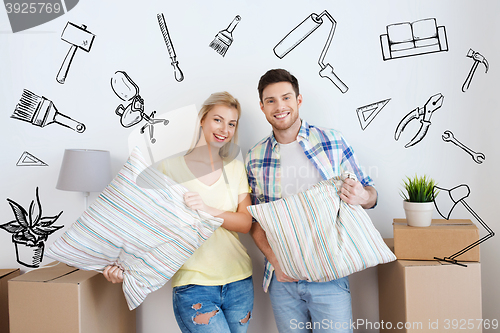 Image of happy couple with stuff moving to new home