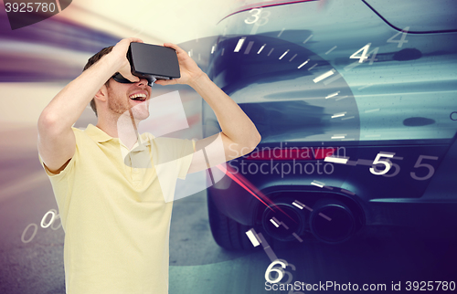 Image of man in virtual reality headset and car racing game