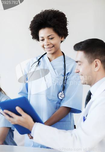 Image of happy doctors meeting at hospital office