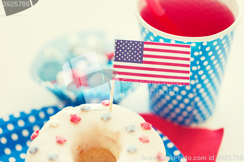 Image of donut with juice and candies on independence day