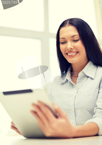 Image of smiling businesswoman or student with tablet pc