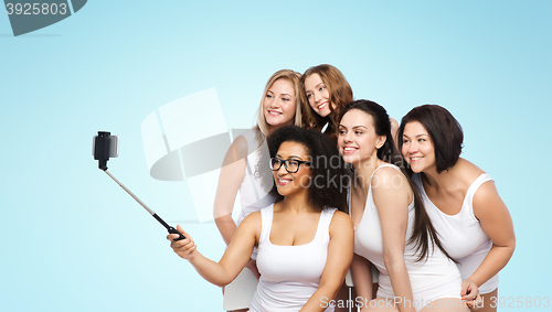 Image of group of happy women taking selfie by smartphoone