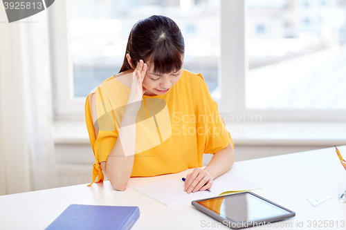 Image of tired asian woman student with tablet pc at home