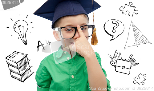 Image of boy in bachelor hat and eyeglasses over doodles