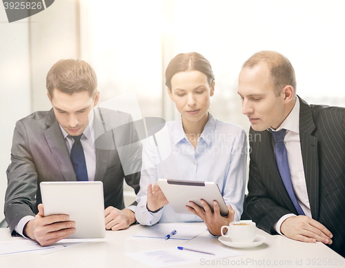 Image of business team with tablet pc having discussion