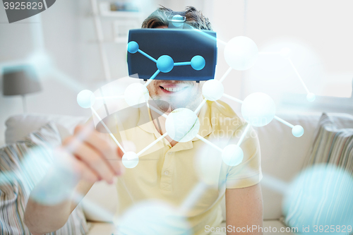 Image of young man in virtual reality headset or 3d glasses