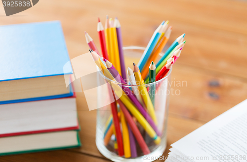 Image of close up of crayons or color pencils and books