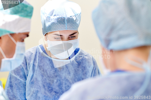 Image of group of surgeons in operating room at hospital