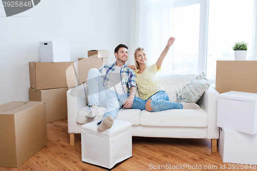 Image of couple with boxes moving to new home and dreaming