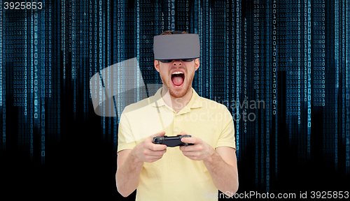 Image of angry man in virtual reality headset with gamepad