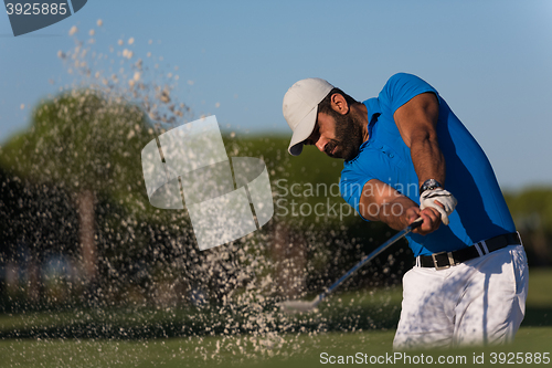 Image of pro golfer hitting a sand bunker shot