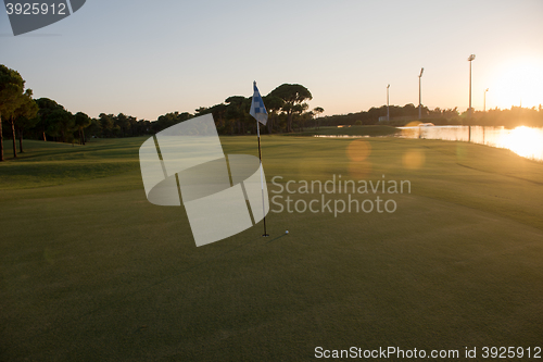 Image of golf ball on edge of  the hole