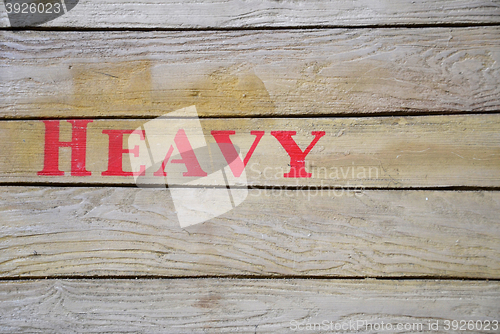 Image of Heavy word on  wooden box