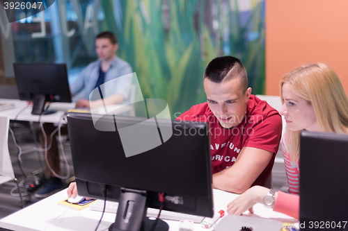 Image of technology students group in computer lab school  classroom