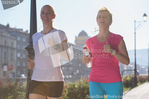 Image of female friends jogging