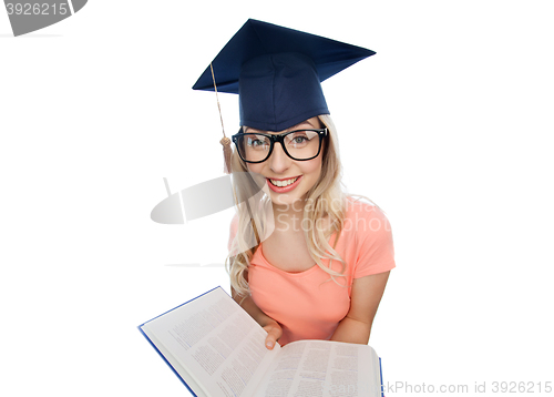 Image of student woman in mortarboard with encyclopedia