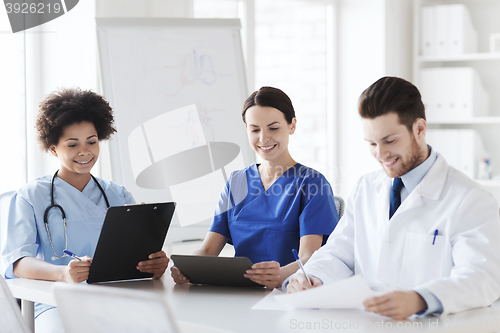 Image of group of happy doctors meeting at hospital office