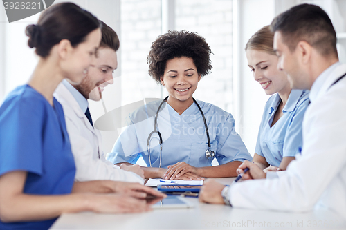 Image of group of happy doctors meeting at hospital office