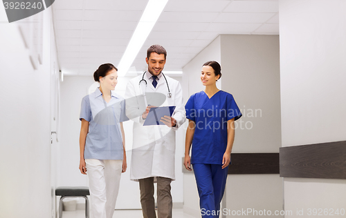 Image of group of medics at hospital with clipboard