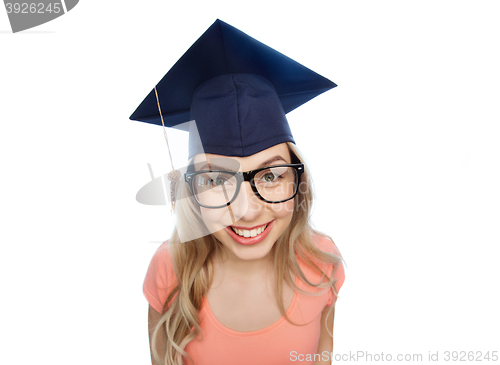 Image of smiling young student woman in mortarboard