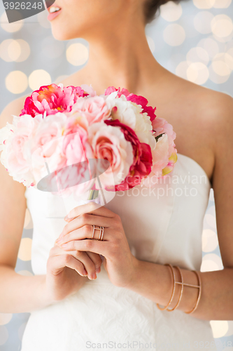 Image of close up of woman or bride with flower bouquet