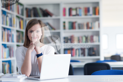 Image of female student study in school library