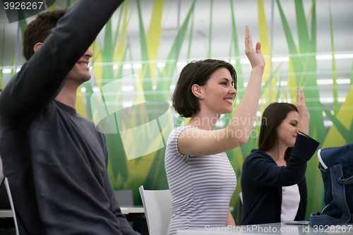 Image of students group raise hands up