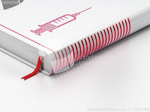 Image of Health concept: closed book, Syringe on white background