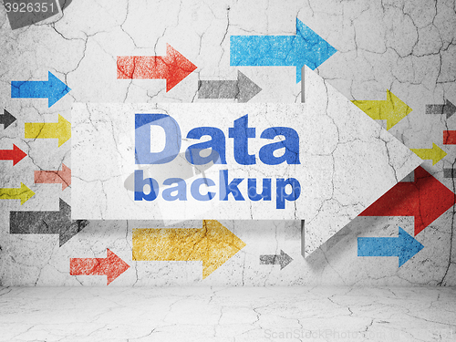 Image of Data concept: arrow with Data Backup on grunge wall background