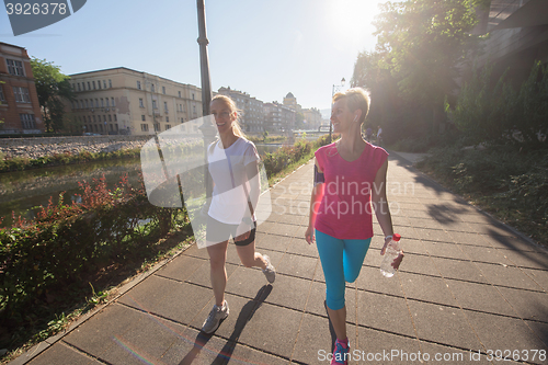 Image of female friends jogging