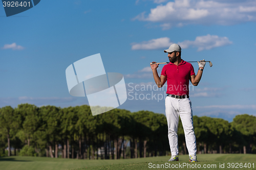 Image of handsome middle eastern golf player portrait at course