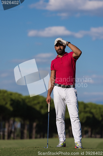 Image of handsome middle eastern golf player portrait at course