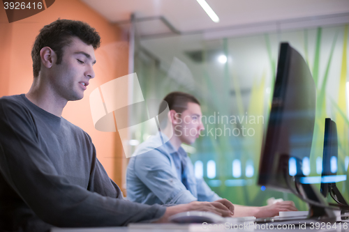 Image of technology students group working  in computer lab school  class