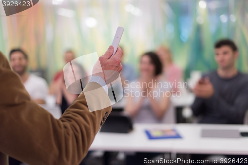 Image of close up of teacher hand while teaching in classroom