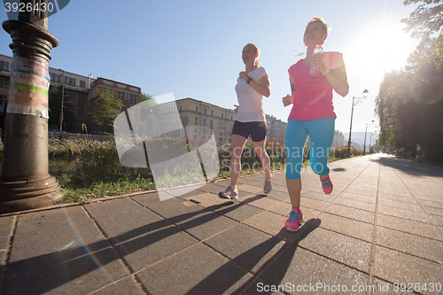 Image of female friends jogging