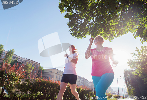 Image of female friends jogging